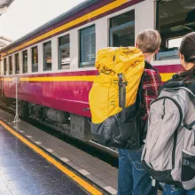 Backpackers at a train station