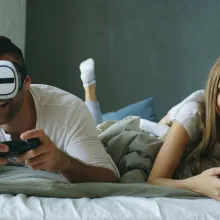 man and woman playing games on console using vr