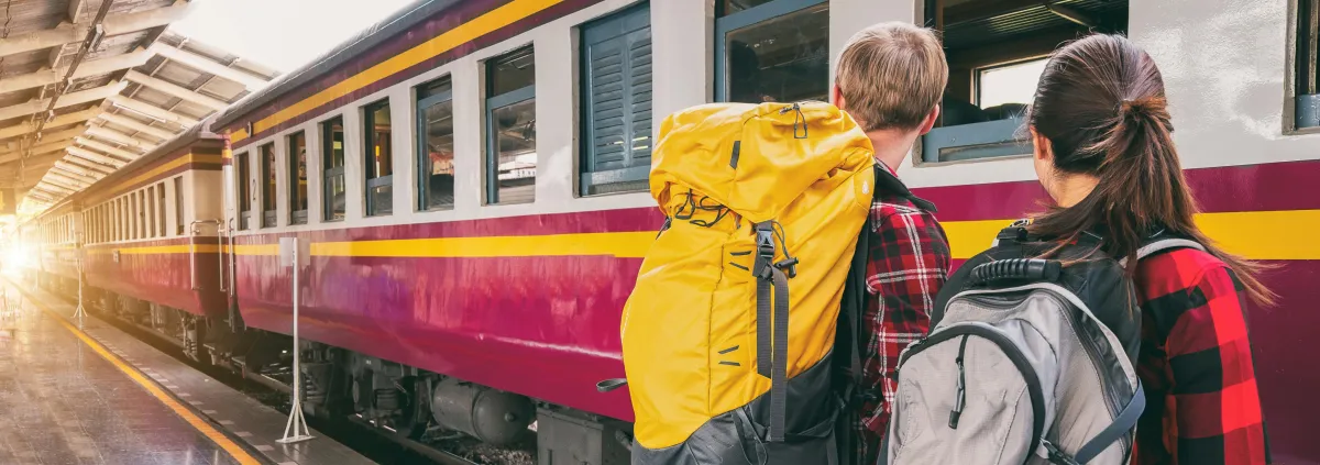 Backpackers at a train station